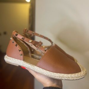 Brown flats with studs on straps